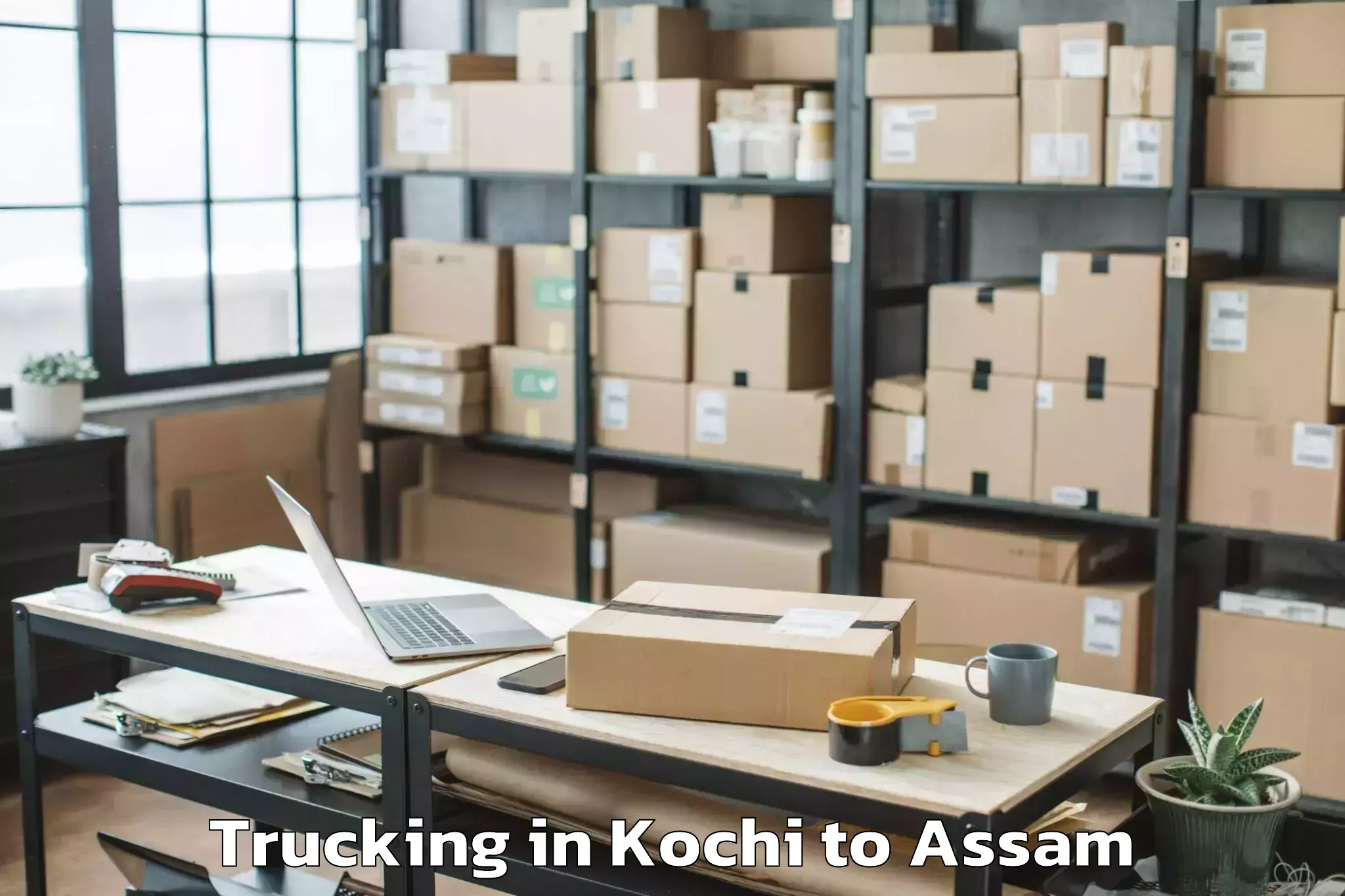 Book Kochi to Dhakuakhana Pt Trucking Online